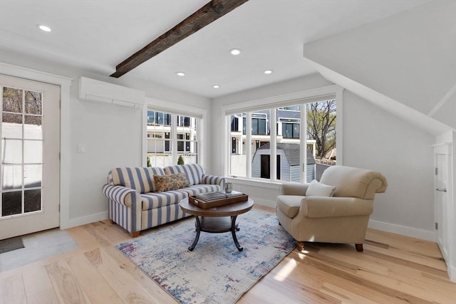 living room with baseboards, an AC wall unit, recessed lighting, and wood finished floors