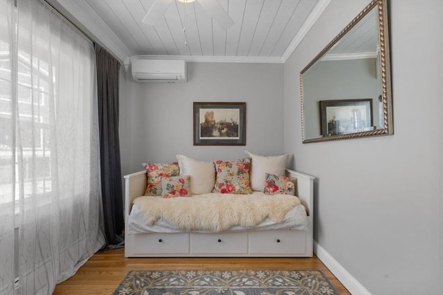 bedroom featuring an AC wall unit, a ceiling fan, ornamental molding, and light wood-style flooring