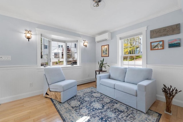 living room with ornamental molding, wainscoting, wood finished floors, baseboard heating, and a wall mounted AC