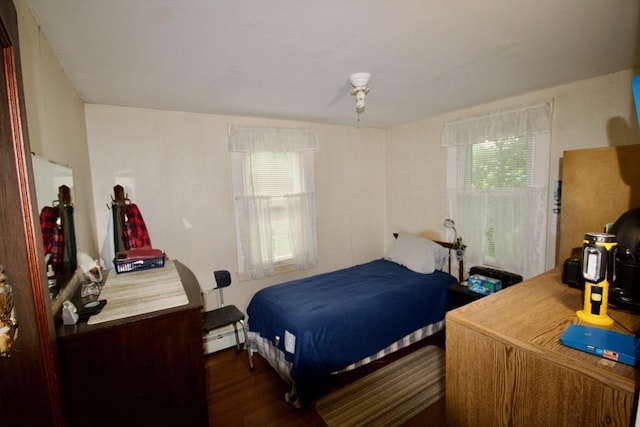 66-R Beach St, Warren, RI 02885 - bedroom with multiple windows, dark wood-style floors, and a baseboard radiator