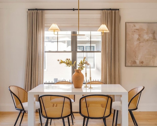 dining area featuring light wood-type flooring