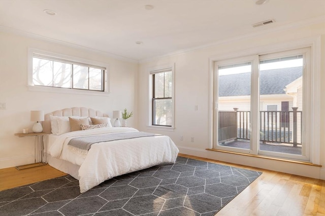 bedroom featuring dark hardwood / wood-style floors and crown molding