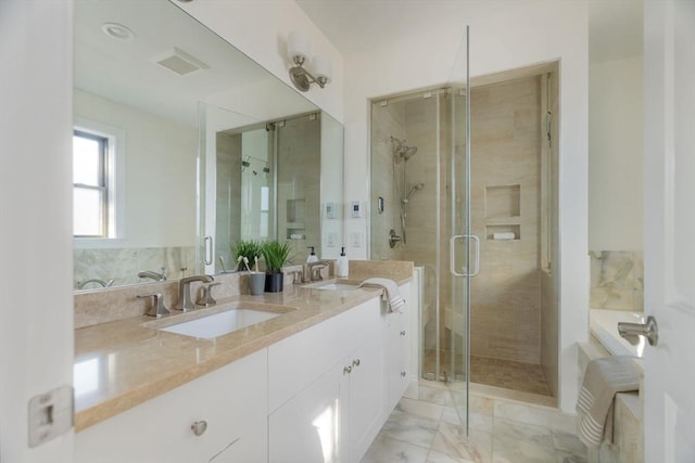 bathroom with vanity and an enclosed shower