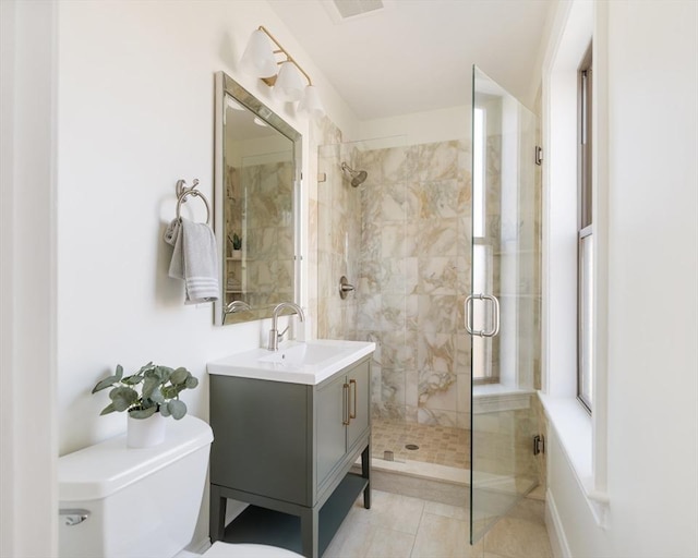 bathroom with a shower with shower door, tile patterned floors, toilet, and vanity