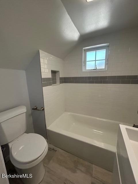 15 Murray Ave, North Adams, MA 01247 - bathroom featuring vaulted ceiling, toilet, and vanity