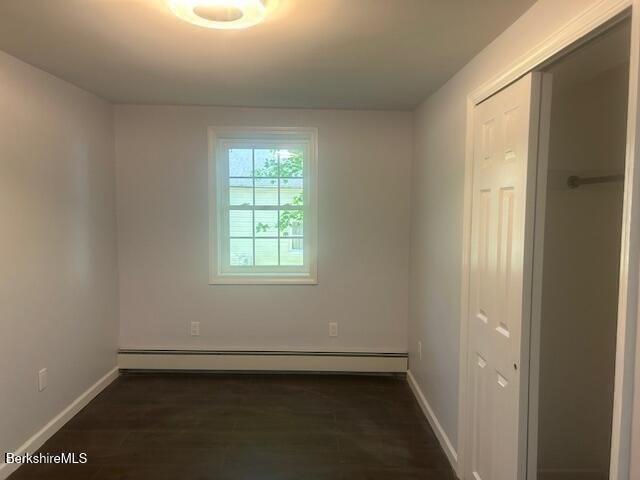 15 Murray Ave, North Adams, MA 01247 - spare room with baseboard heating, baseboards, and dark wood-type flooring