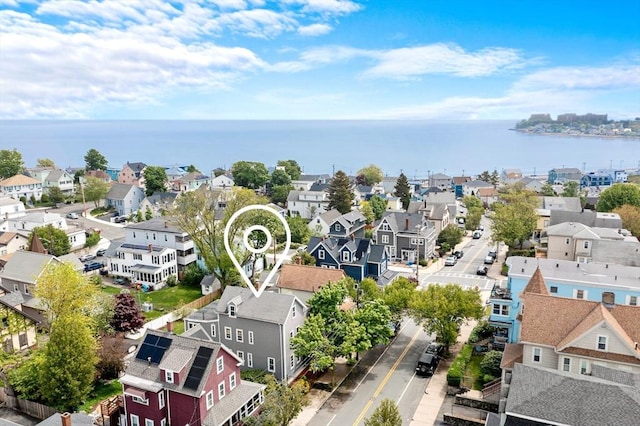 aerial perspective of suburban area featuring a large body of water