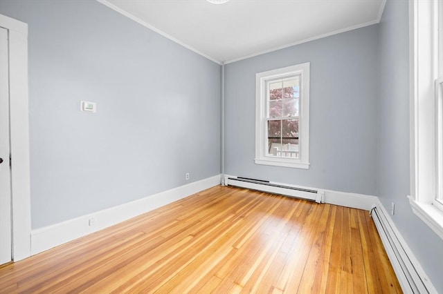 unfurnished room featuring baseboard heating, a baseboard radiator, crown molding, hardwood / wood-style floors, and baseboards