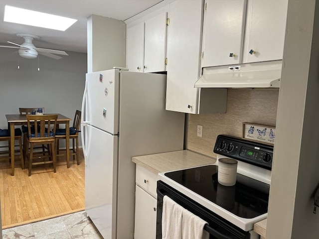 96 Main St Unit C8, Foxboro, MA 02035 - kitchen with range with electric stovetop, under cabinet range hood, light countertops, ceiling fan, and white cabinetry