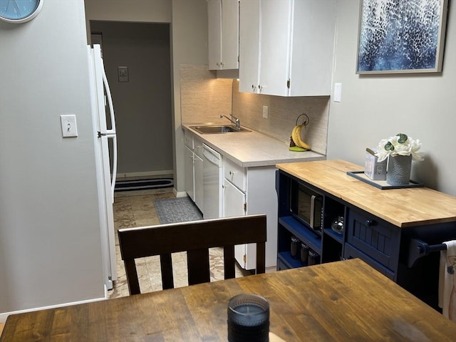 96 Main St Unit C8, Foxboro, MA 02035 - kitchen featuring backsplash, white cabinets, freestanding refrigerator, and butcher block countertops