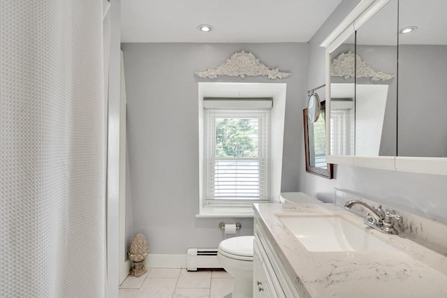 full bath with toilet, baseboards, baseboard heating, and vanity