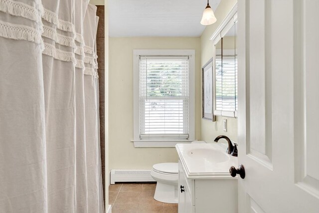 full bathroom with baseboard heating, toilet, a shower with shower curtain, tile patterned flooring, and vanity