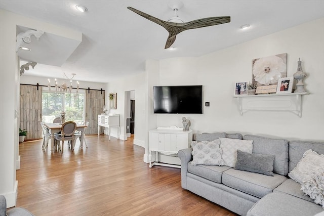 living area featuring wood finished floors and a ceiling fan