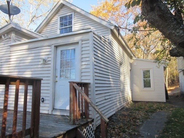 rear view of house featuring a deck