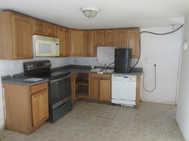 kitchen with white appliances and sink