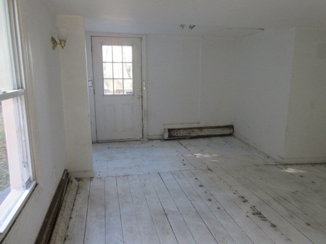 unfurnished room with light hardwood / wood-style floors