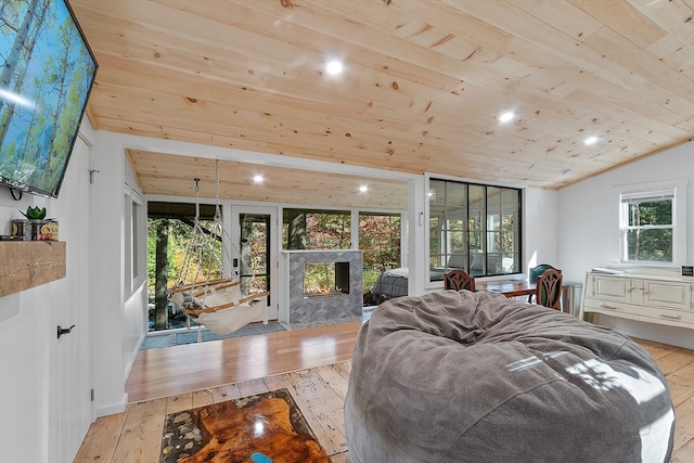 bedroom featuring access to outside, wooden ceiling, lofted ceiling, and light wood-type flooring