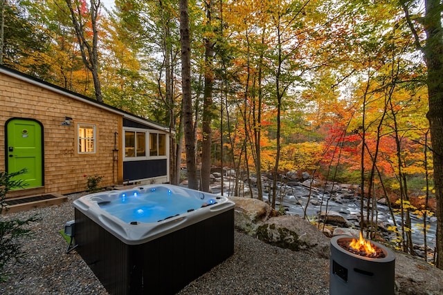 exterior space featuring a hot tub