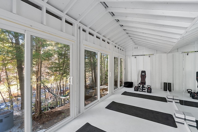 sunroom / solarium featuring lofted ceiling