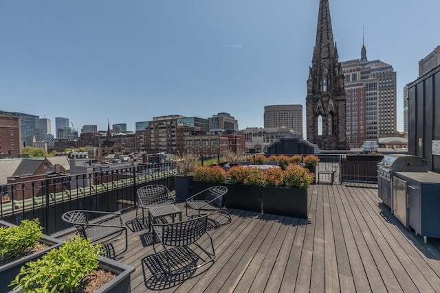 deck with a skyline view and grilling area