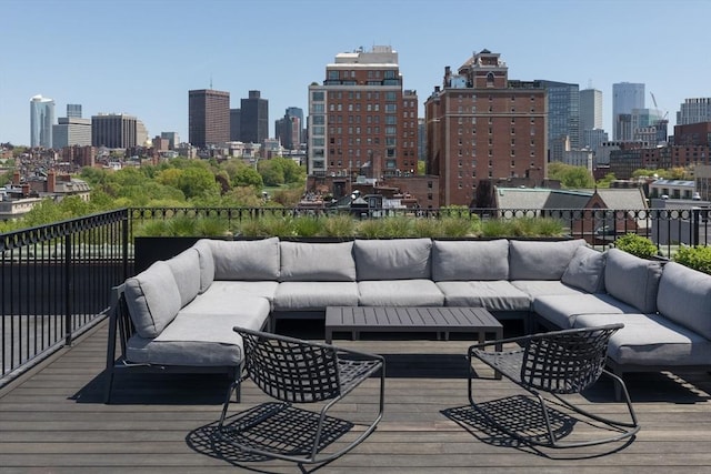 deck with an outdoor hangout area and a view of skyline