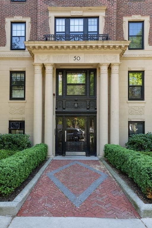 property entrance featuring stone siding
