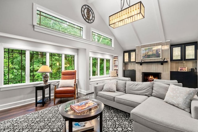 33 Philemon Whale Ln, Sudbury, MA 01776 - living room with wood finished floors, a large fireplace, high vaulted ceiling, and beamed ceiling