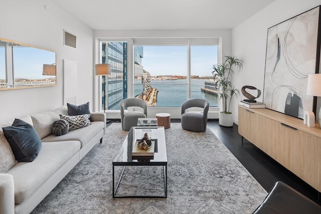 150 Seaport Blvd Unit 11C, Boston, MA 02210 - living room with dark wood-style flooring and a water view