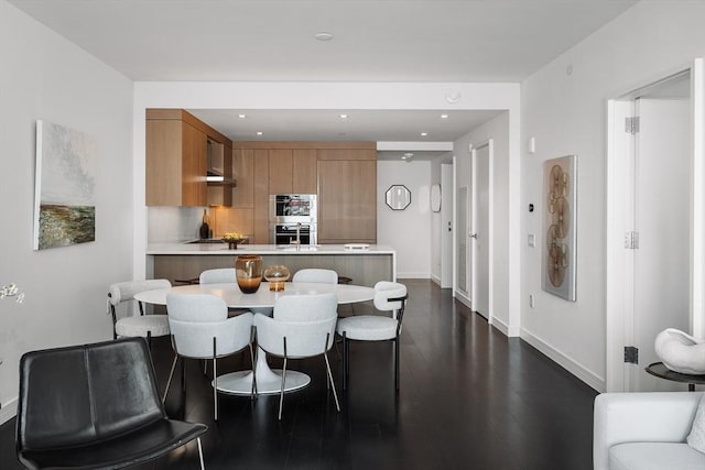 150 Seaport Blvd Unit 11C, Boston, MA 02210 - dining space with baseboards, dark wood finished floors, and recessed lighting