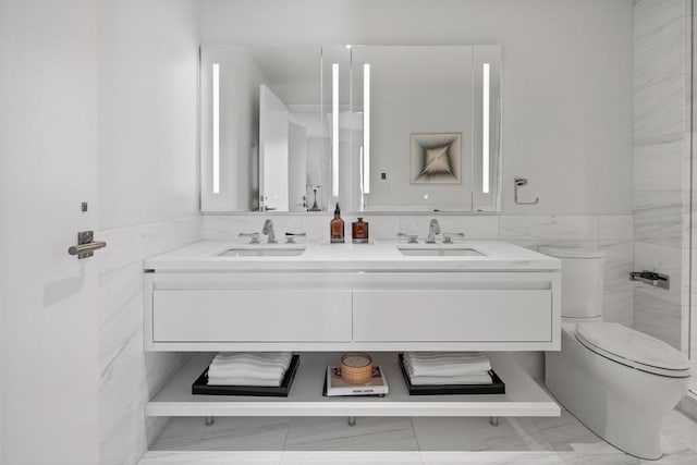 150 Seaport Blvd Unit 11C, Boston, MA 02210 - bathroom with toilet, double vanity, and marble look tiles