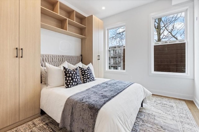 157 Princeton St Unit 1, Boston, MA 02128 - bedroom featuring baseboards, wood finished floors, and recessed lighting
