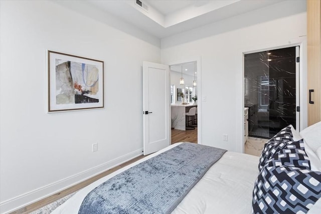 157 Princeton St Unit 1, Boston, MA 02128 - bedroom with baseboards and connected bathroom