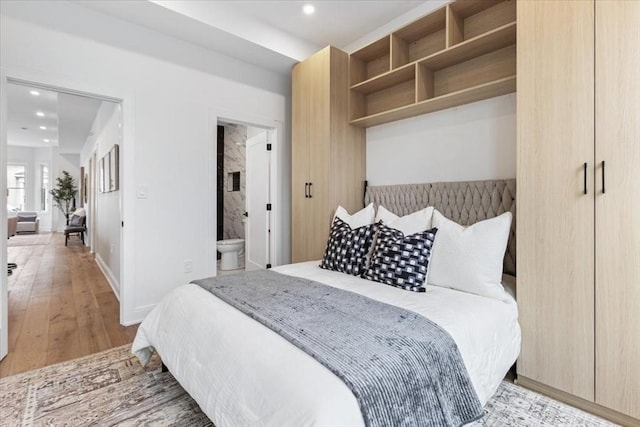 157 Princeton St Unit 1, Boston, MA 02128 - bedroom with recessed lighting, light wood-style flooring, and ensuite bathroom