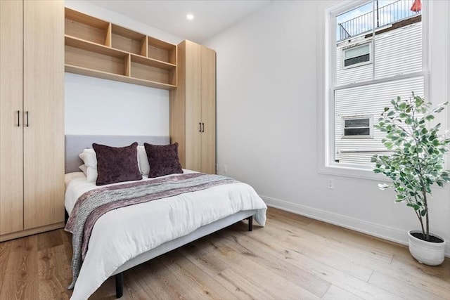 157 Princeton St Unit 1, Boston, MA 02128 - bedroom with wood finished floors, baseboards, and recessed lighting