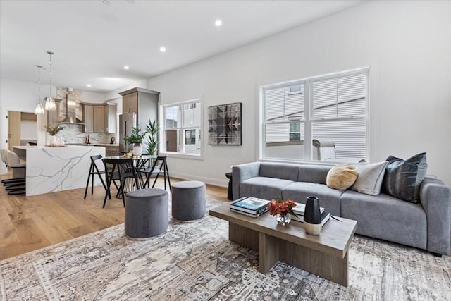 157 Princeton St Unit 1, Boston, MA 02128 - living area featuring light wood finished floors, recessed lighting, and baseboards