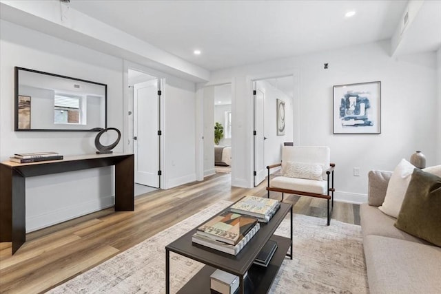 157 Princeton St Unit 1, Boston, MA 02128 - living area with wood finished floors, baseboards, and recessed lighting