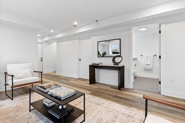 157 Princeton St Unit 1, Boston, MA 02128 - living area with wood finished floors, baseboards, and recessed lighting