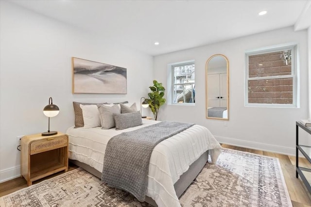 157 Princeton St Unit 1, Boston, MA 02128 - bedroom with wood finished floors, baseboards, and recessed lighting