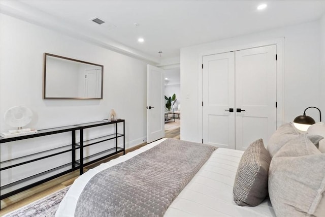 157 Princeton St Unit 1, Boston, MA 02128 - bedroom with recessed lighting, wood finished floors, a closet, and baseboards