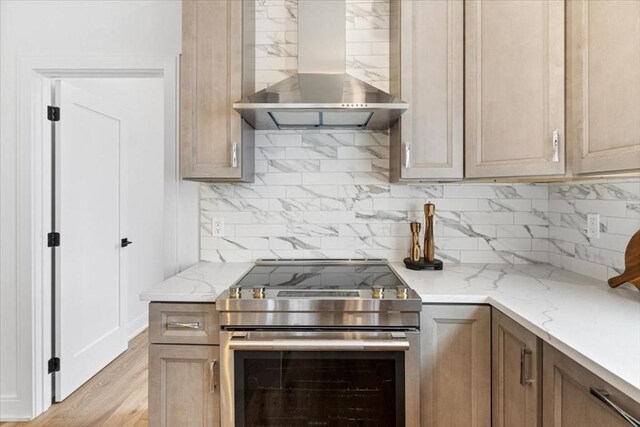 157 Princeton St Unit 1, Boston, MA 02128 - kitchen featuring wall chimney exhaust hood, stainless steel electric range oven, backsplash, and light stone counters