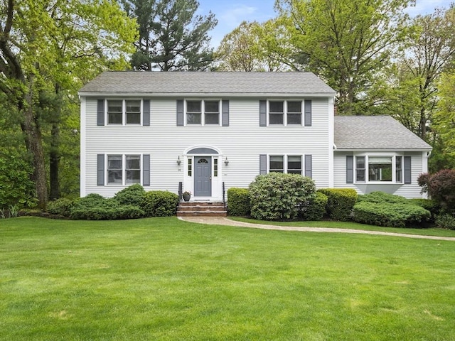 22 Windemere Dr, Andover, MA 01810 - colonial-style house featuring a front yard and a shingled roof
