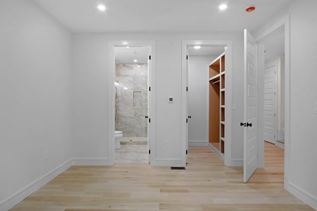 293 Cross St, Norwell, MA 02061 - unfurnished bedroom featuring a spacious closet, wood finished floors, recessed lighting, and connected bathroom