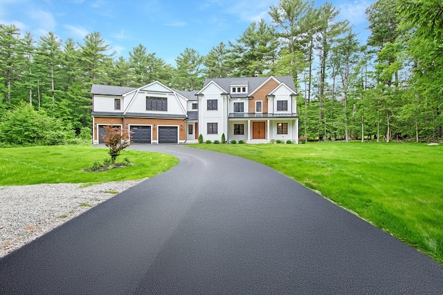 293 Cross St, Norwell, MA 02061 - view of front facade with an attached garage, driveway, a front yard, and covered porch