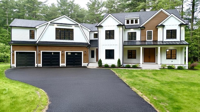 293 Cross St, Norwell, MA 02061 - view of front facade featuring a standing seam roof, an attached garage, asphalt driveway, and board and batten siding