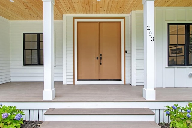 293 Cross St, Norwell, MA 02061 - view of exterior entry featuring a porch and board and batten siding