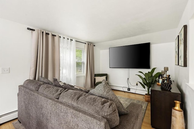 186 Andover St, North Andover, MA 01845 - living room featuring a baseboard heating unit and wood finished floors