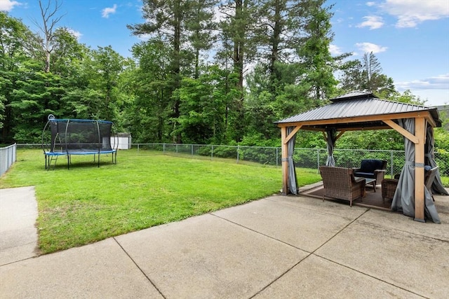 186 Andover St, North Andover, MA 01845 - fenced backyard featuring a patio area, a trampoline, and a gazebo