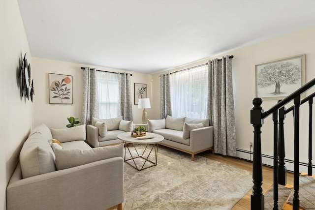 186 Andover St, North Andover, MA 01845 - living room featuring light wood-style flooring, stairway, and baseboard heating