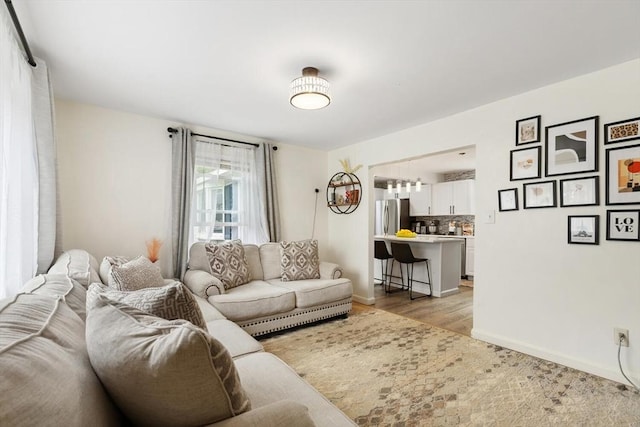 186 Andover St, North Andover, MA 01845 - living room with baseboards and light wood-style floors