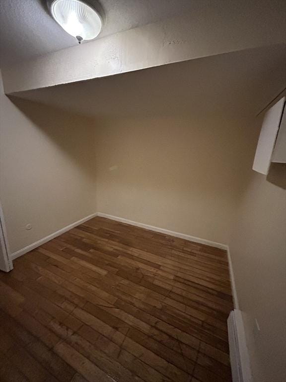 basement featuring dark wood-type flooring